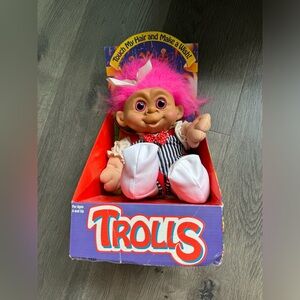 Vintage 1992 troll with red, white & blue jumpsuit, pink eyes and hair.